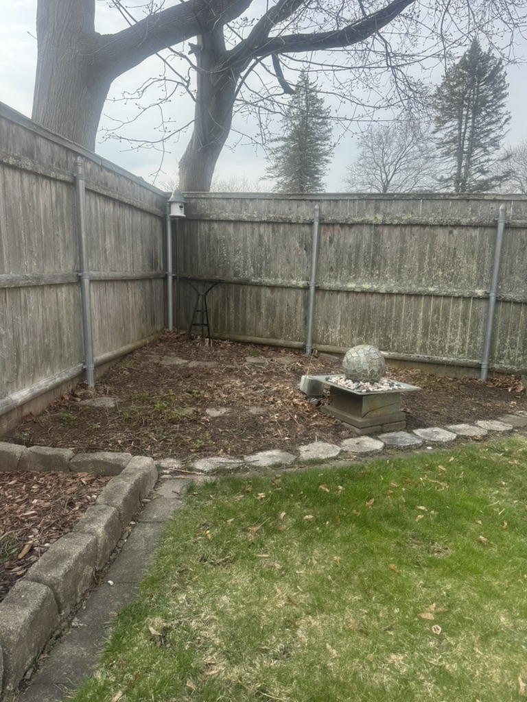Before: Bed needing mulch